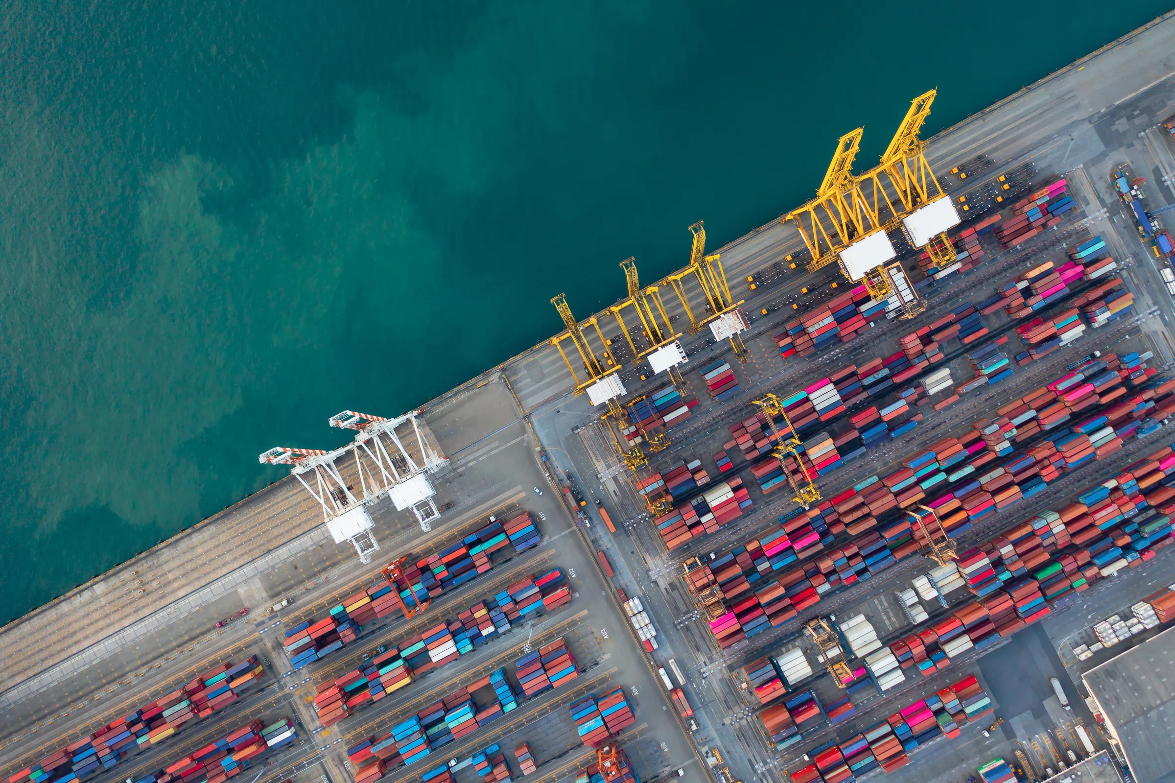 Aerial of a container terminal on teal water