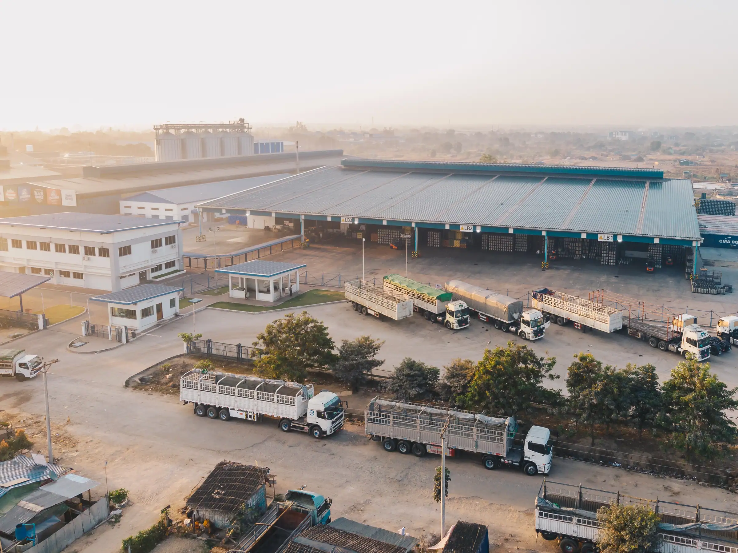 Aerial of a truck depot beside a distribution warehouse