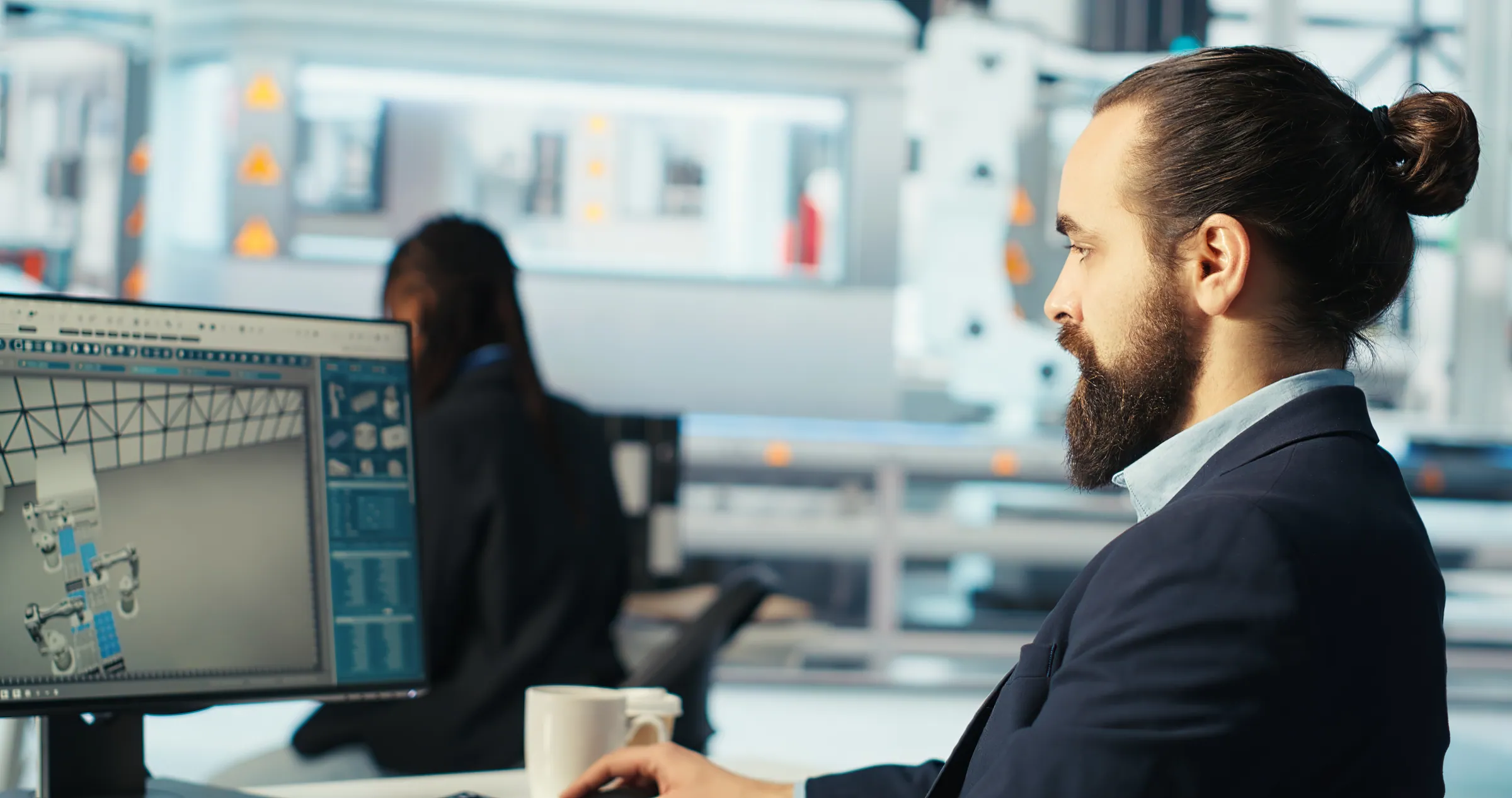 Engineer in a suit diagnosing systems at a workstation