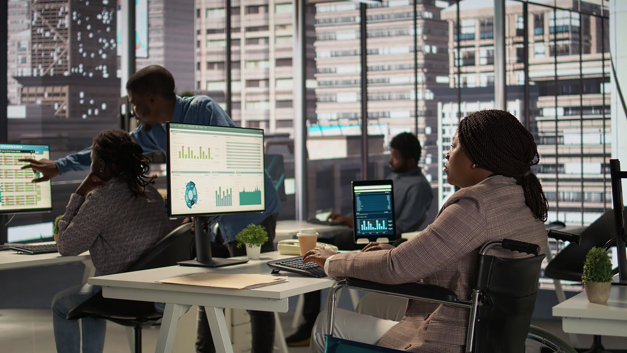 Manager reviewing financial dashboards in an open office